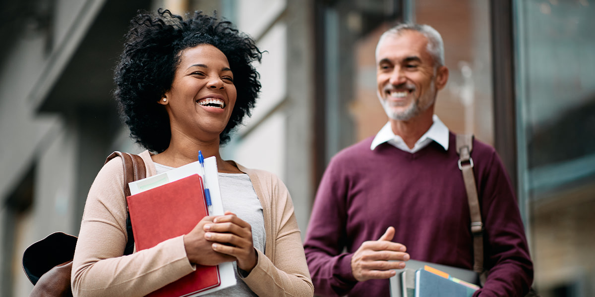 Smiling college professors talking