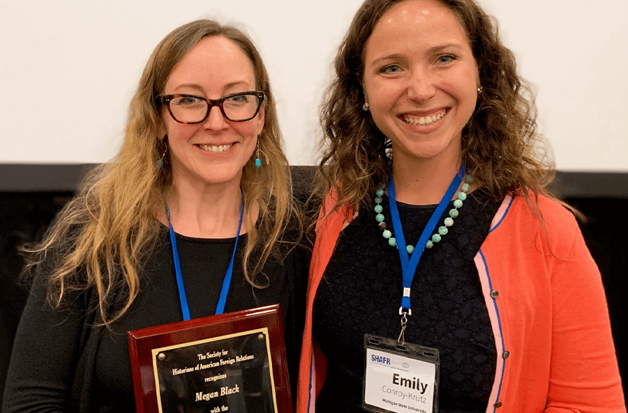 2019 Megan Black receiving Bernath Book Prize from Emily Conroy-Krutz